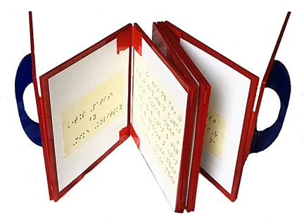 Eight acrylic pages with poetry lines cut into them are arranged in a "concertina" shape with handles on the outer edge so that the acylic pages can be opened and closed line a concertina.  One side of the concertina pages is in laser cut English text and the opposite side of each acrylic page is a Braille version of each poetry line making the art work accessible and tactile.  This view shows the Braille side.