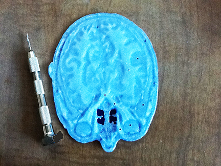 Top surface of 3D printed head section with drilled holes.