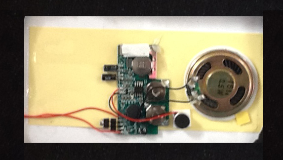 Audio device similar to audio generating mechanism in talking greeting cards
